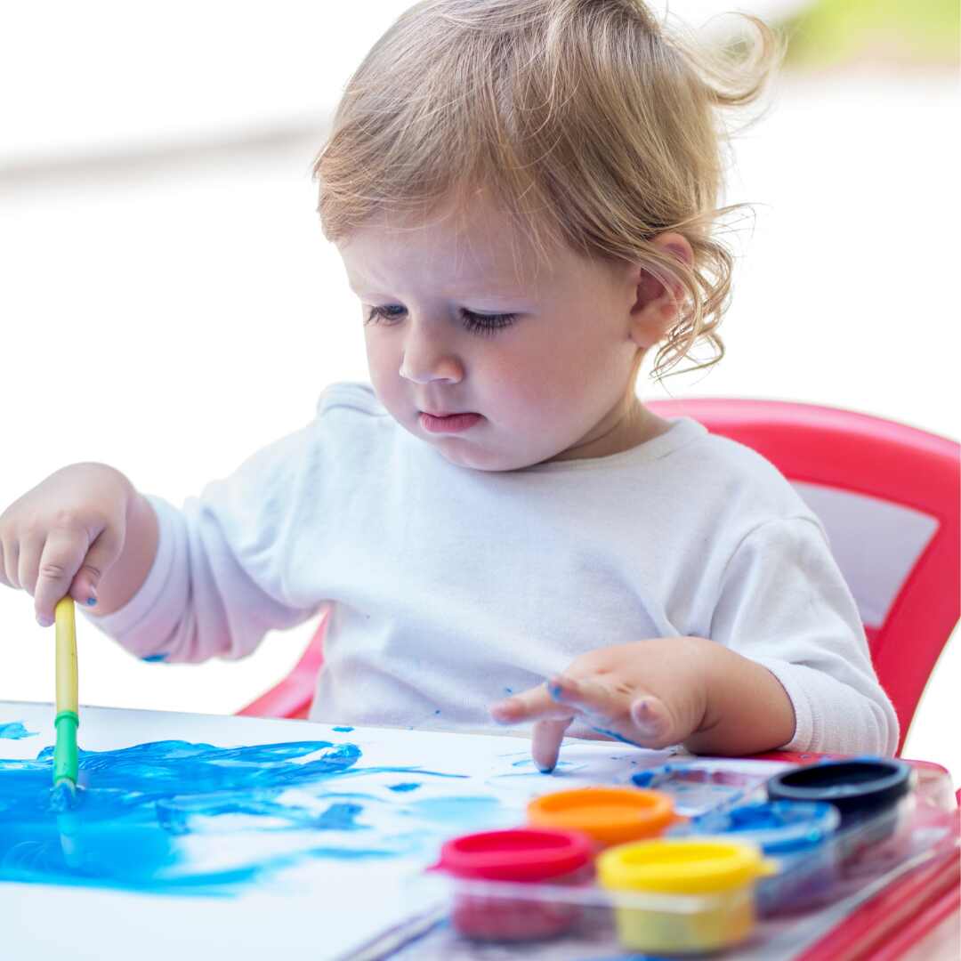 Baby playing with colors